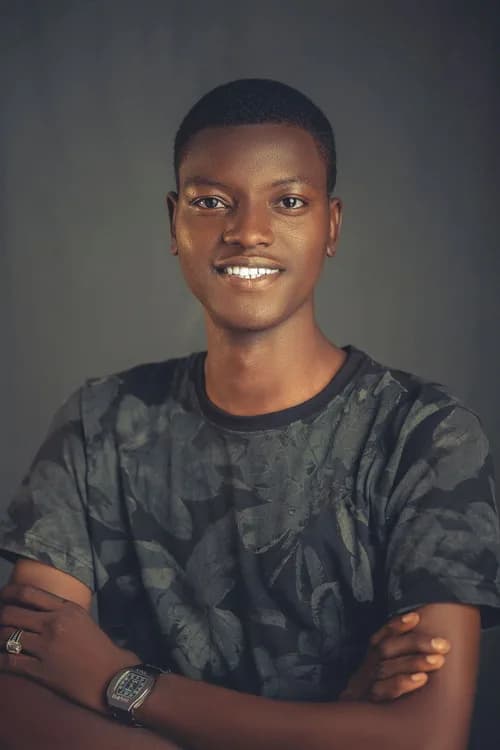 A smiling man wearing a casual shirt